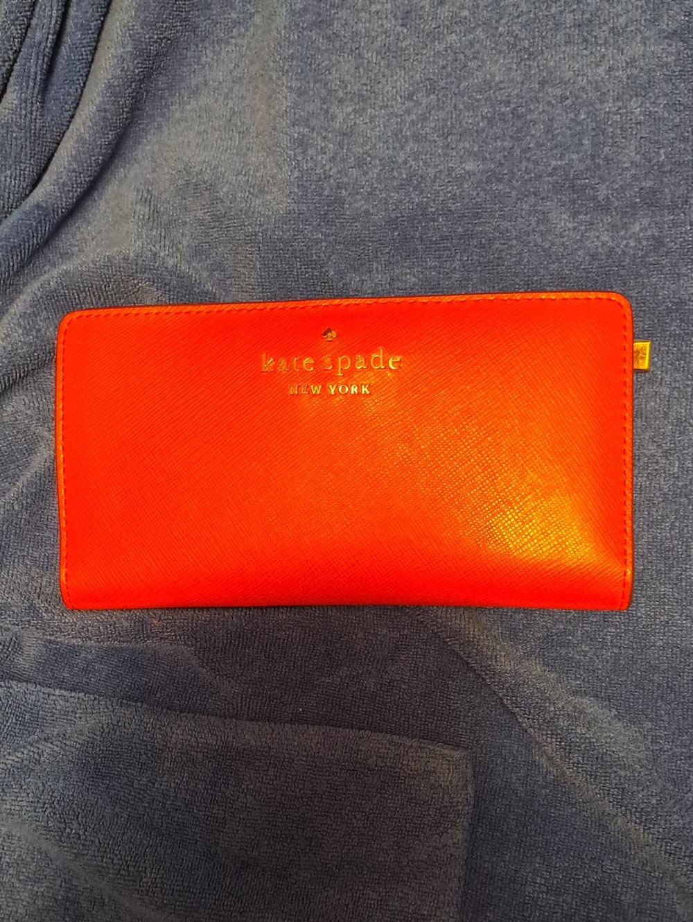 Kate Spade bright red zip-around Saffiano wallet